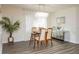 Inviting dining area featuring modern light fixture, glass table, and hardwood style floors, perfect for gatherings at 7120 36Th N Ave, St Petersburg, FL 33710