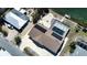 Waterfront home with solar panels, a screened in pool, and backyard patio with a canal view at 741 W Perry St, Englewood, FL 34223