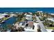 Aerial view of canal-front homes, highlighting waterfront access and neighborhood charm with a glimpse of ocean at 741 W Perry St, Englewood, FL 34223