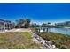 Spacious backyard with access to a private dock, providing easy access to the canal and waterfront activities at 741 W Perry St, Englewood, FL 34223