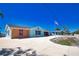 Brightly colored single-story home with a long driveway and well-manicured lawn at 741 W Perry St, Englewood, FL 34223