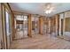 Open living room featuring new wood-look tile floors and a ceiling fan at 741 W Perry St, Englewood, FL 34223