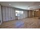 Spacious open-concept living area under renovation with tile floors and exposed framing at 741 W Perry St, Englewood, FL 34223
