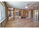 Open living space with new floors leading to in-progress bathroom and sink area at 741 W Perry St, Englewood, FL 34223