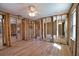 Open living space with new floors leading to an in-progress bathroom at 741 W Perry St, Englewood, FL 34223