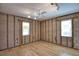 Spacious room featuring track lighting, ceiling fan, and two windows allowing ample light at 741 W Perry St, Englewood, FL 34223