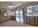 Sunroom overlooking pool, with tiled floors, awaiting remodel, with sliding glass doors at 741 W Perry St, Englewood, FL 34223