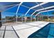A sunny pool area featuring ample space for lounging, relaxation, and enjoying waterfront views at 741 W Perry St, Englewood, FL 34223
