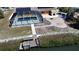 Gorgeous screened pool, dock, and patio create a backyard oasis for relaxing and entertaining at 741 W Perry St, Englewood, FL 34223