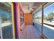 Screened-in porch showcasing tiled floors and vibrant exterior paint colors at 741 W Perry St, Englewood, FL 34223