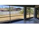 Screened back porch overlooking a fenced backyard with landscaping, creating a relaxing and private outdoor space at 7499 Clearwater St, Englewood, FL 34224