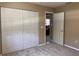 Bedroom showcases neutral carpet, large closet, fresh paint, and an open doorway to an adjoining room at 7499 Clearwater St, Englewood, FL 34224