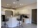 Kitchen features breakfast bar seating, lots of lighting, stainless appliances, and an adjoining office area at 7499 Clearwater St, Englewood, FL 34224