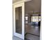 View of the living room featuring tiled floors and sliding glass doors to backyard at 7499 Clearwater St, Englewood, FL 34224