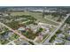 A high angle view of the home outlined in red, showing proximity to the golf course and other community amenities at 820 Bayshore Dr, Englewood, FL 34223