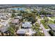 Wide aerial view of the home with pool and detached garage in its neighborhood setting at 820 Bayshore Dr, Englewood, FL 34223