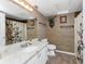 Bathroom featuring a single vanity sink, tiled floors, and shower with curtain at 820 Bayshore Dr, Englewood, FL 34223