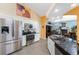 Modern kitchen with stainless steel appliances, granite countertops, and ample cabinet space at 820 Bayshore Dr, Englewood, FL 34223