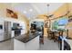 Gourmet kitchen with stainless steel appliances, granite countertops, and views of the living area at 820 Bayshore Dr, Englewood, FL 34223