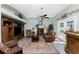 Cozy living room with a fireplace, comfortable seating, and abundant natural light at 820 Bayshore Dr, Englewood, FL 34223