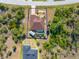 Overhead view of the property with a private pool, mature trees, and a well-maintained yard at 8251 Arlewood Cir, Port Charlotte, FL 33981