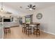 Dining area featuring a wooden table with seating for four, modern lighting at 8251 Arlewood Cir, Port Charlotte, FL 33981