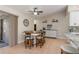 Dining area with seating for four, modern lighting and tile flooring at 8251 Arlewood Cir, Port Charlotte, FL 33981