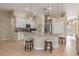 Kitchen island with granite countertops, pendant lighting, and bar stool seating at 8251 Arlewood Cir, Port Charlotte, FL 33981