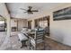 Relaxing covered patio with ample seating, ideal for enjoying the outdoors and entertaining guests at 8251 Arlewood Cir, Port Charlotte, FL 33981