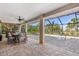 Relaxing screened lanai with a dining set and view of the refreshing pool, perfect for outdoor gatherings at 8251 Arlewood Cir, Port Charlotte, FL 33981