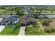 Beautiful aerial shot of the property showcasing its well-manicured lawn, inviting facade, and surrounding waterways at 8304 Antwerp Cir, Port Charlotte, FL 33981
