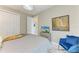 Inviting bedroom with light gray walls, stylish artwork, and comfortable bedding for a relaxing retreat at 8304 Antwerp Cir, Port Charlotte, FL 33981