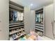 Walk-in closet offers ample storage with shelving, drawers, and hanging space at 8304 Antwerp Cir, Port Charlotte, FL 33981