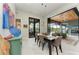 Dining room has large sliding doors to the outside seating area and connects to the living room at 8304 Antwerp Cir, Port Charlotte, FL 33981