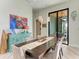Dining room featuring a large table with seating and sliding door access to an outdoor space at 8304 Antwerp Cir, Port Charlotte, FL 33981