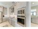 Modern kitchen features stainless steel appliances, granite countertops, and custom gray cabinetry at 8304 Antwerp Cir, Port Charlotte, FL 33981