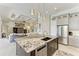 Kitchen with island, granite countertops, stainless steel appliances and open floor plan at 8304 Antwerp Cir, Port Charlotte, FL 33981