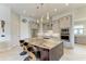 Kitchen with island, granite countertops, stainless steel appliances, and modern lighting at 8304 Antwerp Cir, Port Charlotte, FL 33981