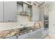 Kitchen with granite countertops, stainless steel appliances, and modern backsplash at 8304 Antwerp Cir, Port Charlotte, FL 33981