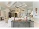 Open living area with coffered ceiling, ceiling fan, modern art, and neutral furniture at 8304 Antwerp Cir, Port Charlotte, FL 33981