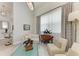 Bright living room featuring neutral furniture, modern art, and lots of natural light at 8304 Antwerp Cir, Port Charlotte, FL 33981