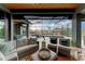Covered patio features a sectional couch, chairs and a view of the enclosed pool and spa at 8304 Antwerp Cir, Port Charlotte, FL 33981