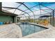 Enclosed pool and spa with canal view and convenient access to interior of home at 8304 Antwerp Cir, Port Charlotte, FL 33981