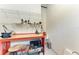 Well-lit workspace with a sturdy workbench, tools neatly organized on shelves, and ample room for projects at 8304 Antwerp Cir, Port Charlotte, FL 33981