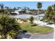Aerial view of the yellow single-Gathering home with a two-car garage at 840 Park Rd, Englewood, FL 34223
