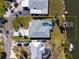 Aerial view of home with a swimming pool and dock in the backyard at 840 Park Rd, Englewood, FL 34223