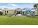 Inviting backyard with screened pool, patio area and well maintained lawn at 840 Park Rd, Englewood, FL 34223