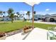 Well maintained backyard with an expansive lawn and charming views of surrounding homes at 840 Park Rd, Englewood, FL 34223