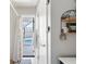 Bright bathroom showcasing a door to an outdoor pool area, blending indoor and outdoor living at 840 Park Rd, Englewood, FL 34223