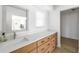 Elegant bathroom featuring a long vanity with white countertops and ample storage drawers at 840 Park Rd, Englewood, FL 34223